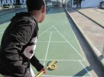 The Boy playing&nbsp;shuffleboard